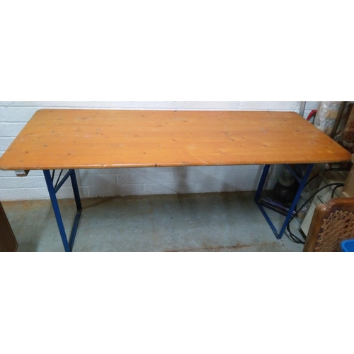 758 - A Folding Wooden Table with Metal Legs. 77cm H x 180cm L x 69cm W.