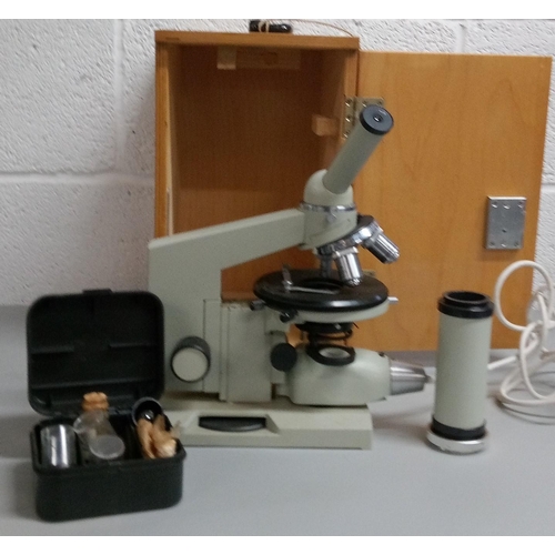 1232 - A Microscope in a Wooden Case.