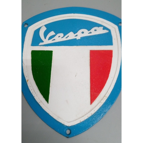 844 - A Vespa Cast Plaque and Tin Sign.