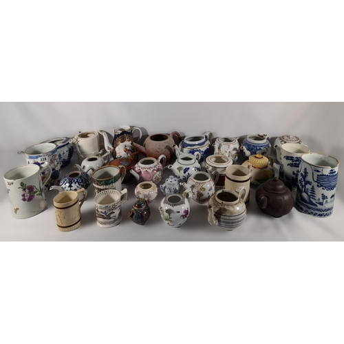 136 - A LARGE COLLECTION OF 18TH / 19TH CENTURY TEAPOTS AND TANKARDS, including Chinese export wares, a Me... 