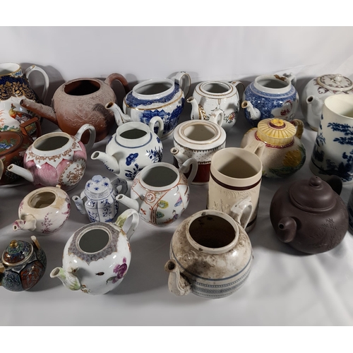 136 - A LARGE COLLECTION OF 18TH / 19TH CENTURY TEAPOTS AND TANKARDS, including Chinese export wares, a Me... 