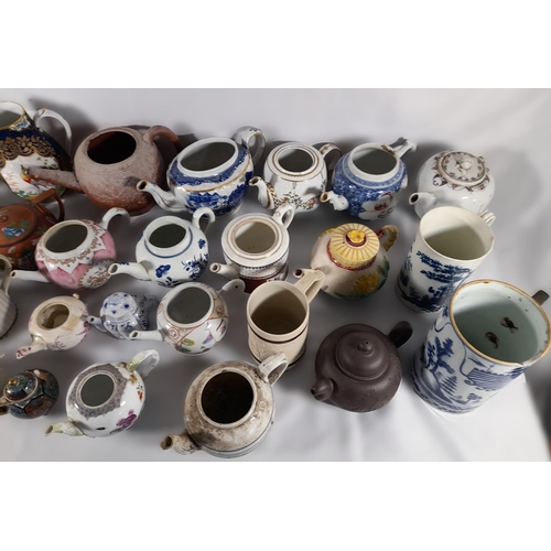 136 - A LARGE COLLECTION OF 18TH / 19TH CENTURY TEAPOTS AND TANKARDS, including Chinese export wares, a Me... 