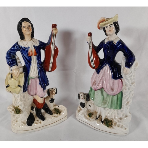 127 - A GROUP OF 19TH CENTURY STAFFORDSHIRE WARES, the lot includes a pair of flat back musician figures, ... 