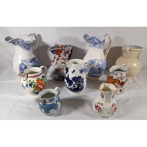 133 - A GROUP OF NINE VARIOUS CERAMIC JUGS, the lot includes a Mason's ironstone jug, a Clarice Cliff Newp... 