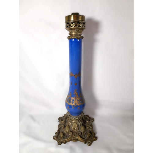 144 - A GROUP OF 19TH CENTURY BRASS AND COLOURED GLASS OIL LAMP BASES, including an attractive green glass... 