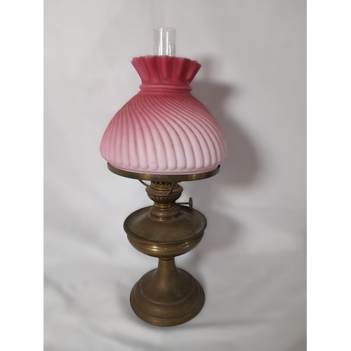 144 - A GROUP OF 19TH CENTURY BRASS AND COLOURED GLASS OIL LAMP BASES, including an attractive green glass... 