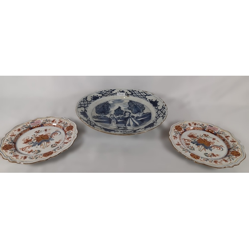 150 - A LATE 18TH/EARLY 19TH CENTURY DUTCH DELFT DISH AND TWO DELFT TIN GLAZE POLYCHROME PLATES, the large... 