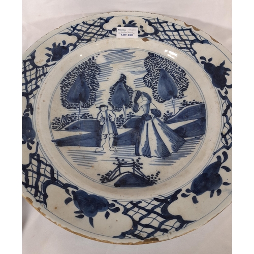 150 - A LATE 18TH/EARLY 19TH CENTURY DUTCH DELFT DISH AND TWO DELFT TIN GLAZE POLYCHROME PLATES, the large... 