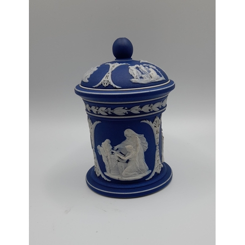 152 - A QUANTITY OF WEDGEWOOD CAMEO DECORATED JASPER WARES, including three biscuit barrels, a pair of can... 