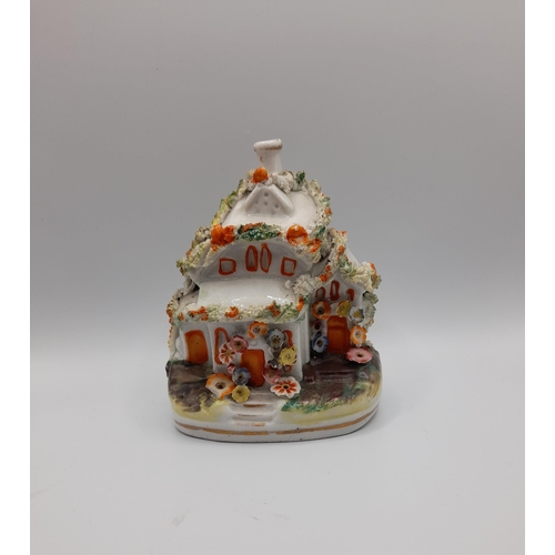 153 - A GROUP OF 19TH CENTURY STAFFORDSHIRE WARES, including a large cottage form pastel burner, toby jug,... 