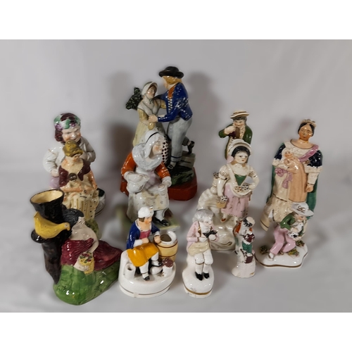 155 - A 19TH CENTURY STAFFORDSHIRE 'SAILOR'S RETURN' FIGURE, along with ten other Staffordshire figures of... 