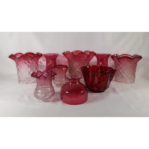 158 - A GROUP OF NINE CRANBERRY TINGED GLASS LAMP SHADES, various styles and sizes, some with etched decor... 