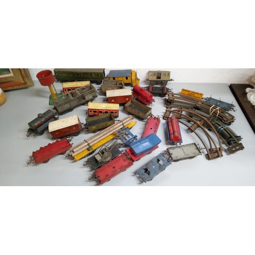 1241 - A Wooden Chest containing Rolling Stock, Track and Accessories. For Hornby O Gauge.