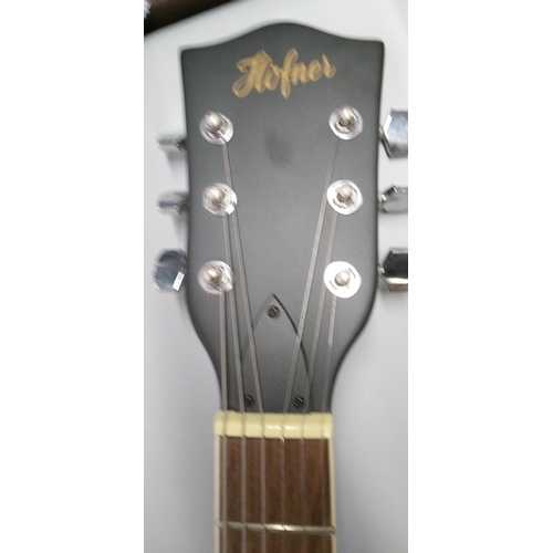 912 - A Hofner Electric Guitar with Strap.