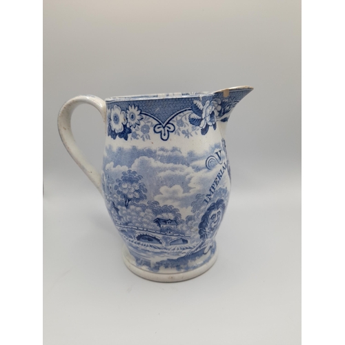 164 - AN EARLY VICTORIAN BLUE & WHITE IMPERIAL MEASURE JUG, the transfer printed sides decorated with buco... 