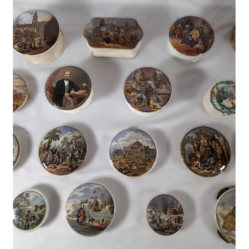 176 - A GROUP OF TWENTY 19TH CENTURY PRATTWARE POT LIDS, eight with associated bases, including an unusual... 