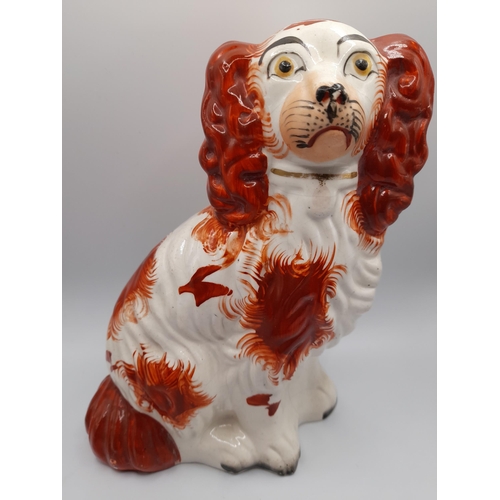 179 - A PAIR OF 19TH CENTURY STAFFORDSHIRE SPANIEL MODELS, along with six other Staffordshire spaniel mode... 