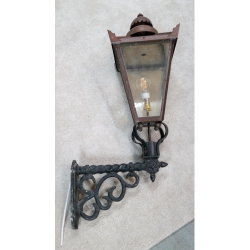 654 - A Copper and Wrought Iron Vintage Style Wall Hanging Outside Lamp. 90cm H x 48cm w.