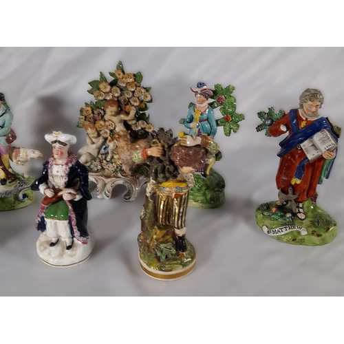 185 - A MIXED GROUP OF 19TH CENTURY FIGURINES, the lot includes a Walton figure of Matthew, two pearlware ... 