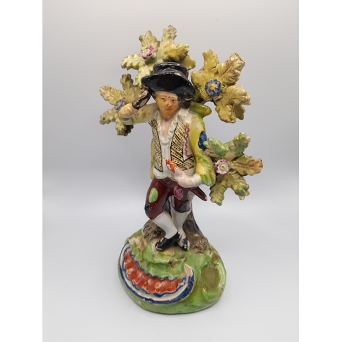 185 - A MIXED GROUP OF 19TH CENTURY FIGURINES, the lot includes a Walton figure of Matthew, two pearlware ... 