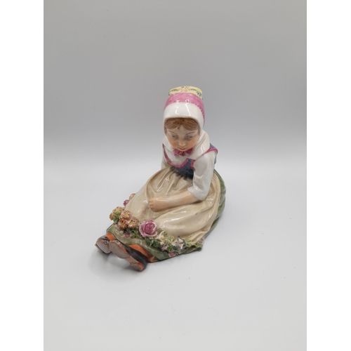 187 - A ROYAL COPENHAGEN FIGURE, 'Flower Girl from Sjalland' from a series by Carl Martin-Hansen, with und... 