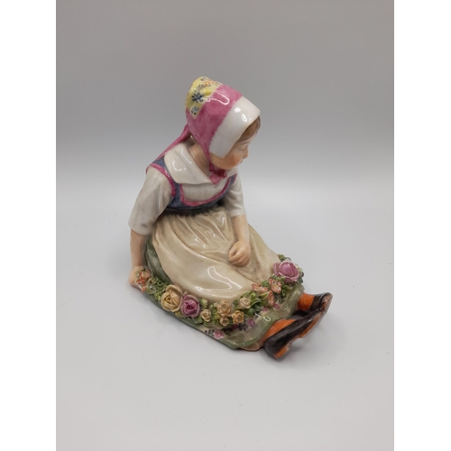 187 - A ROYAL COPENHAGEN FIGURE, 'Flower Girl from Sjalland' from a series by Carl Martin-Hansen, with und... 