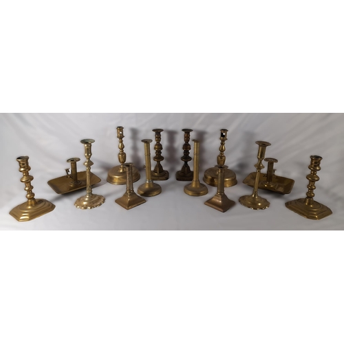 189 - SEVEN PAIRS OF 19TH CENTURY BRASS CANDLESTICKS, including a pair on domed circular feet and a pair o... 