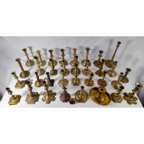 190 - A MIXED COLLECTION OF THIRTY THREE 18TH & 19TH CENTURY BRASS CANDLESTICKS, various shapes and styles... 