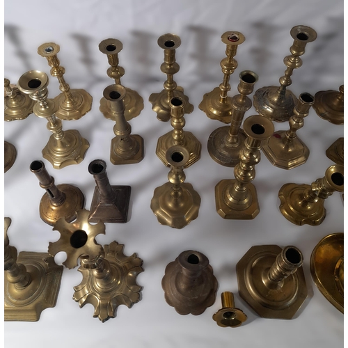 190 - A MIXED COLLECTION OF THIRTY THREE 18TH & 19TH CENTURY BRASS CANDLESTICKS, various shapes and styles... 