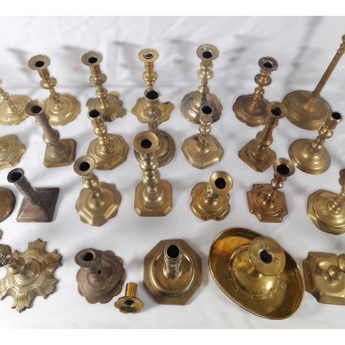 190 - A MIXED COLLECTION OF THIRTY THREE 18TH & 19TH CENTURY BRASS CANDLESTICKS, various shapes and styles... 