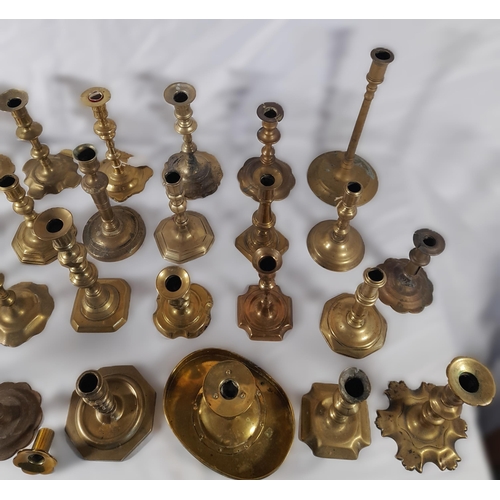 190 - A MIXED COLLECTION OF THIRTY THREE 18TH & 19TH CENTURY BRASS CANDLESTICKS, various shapes and styles... 