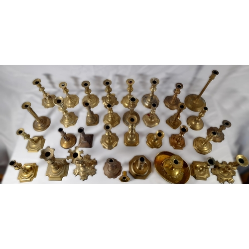 190 - A MIXED COLLECTION OF THIRTY THREE 18TH & 19TH CENTURY BRASS CANDLESTICKS, various shapes and styles... 