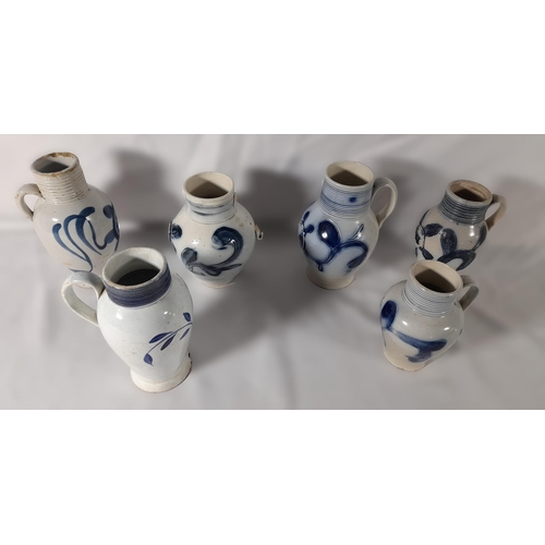 195 - A GROUP OF  SIX STAFFORDSHIRE SCRATCH BLUE SALT GLAZED TAVERN JUGS, LATE 18TH CENTURY
baluster form ... 