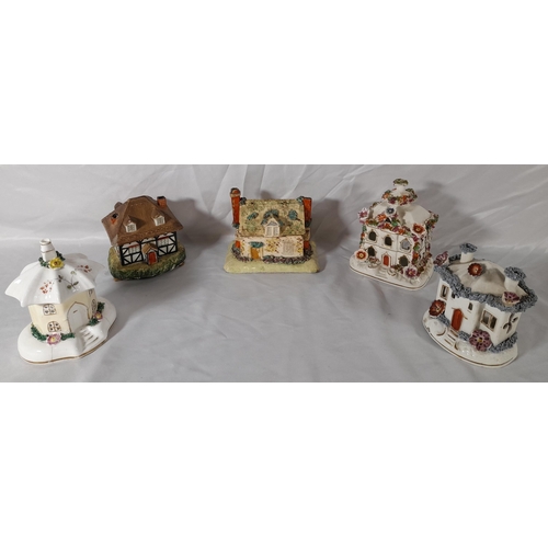 206 - A GROUP OF ELEVEN 19TH CENTURY PASTEL BURNERS, modelled as cottages and houses, various sizes
14.5 c... 