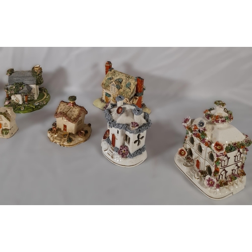 206 - A GROUP OF ELEVEN 19TH CENTURY PASTEL BURNERS, modelled as cottages and houses, various sizes
14.5 c... 