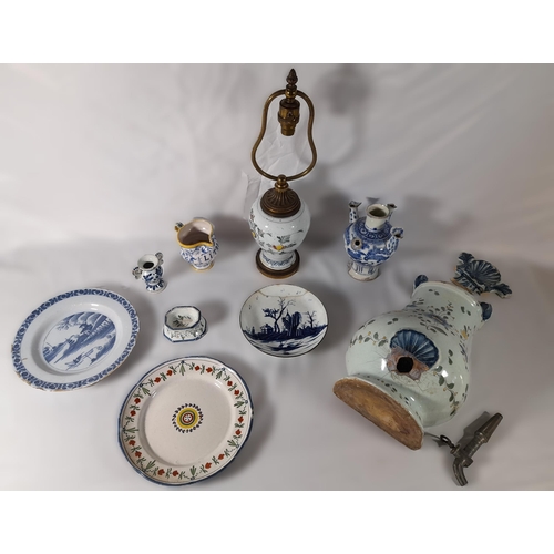 213 - A GROUP OF 18TH/19TH CENTURY FAIENCE POTTERY WARES, including Dutch Delft plates, a polychrome balus... 