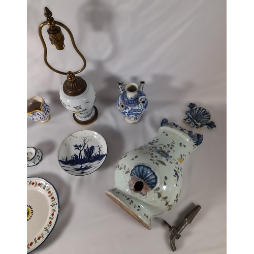 213 - A GROUP OF 18TH/19TH CENTURY FAIENCE POTTERY WARES, including Dutch Delft plates, a polychrome balus... 