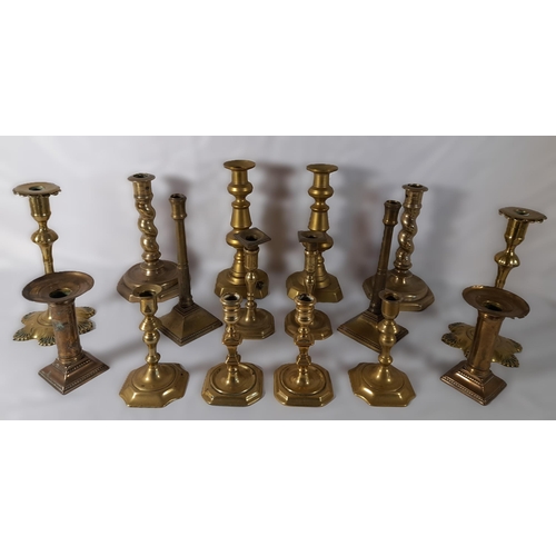 215 - EIGHT PAIRS OF 19TH CENTURY BRASS CANDLESTICKS, various styles and sizes, including knopped pillar a... 