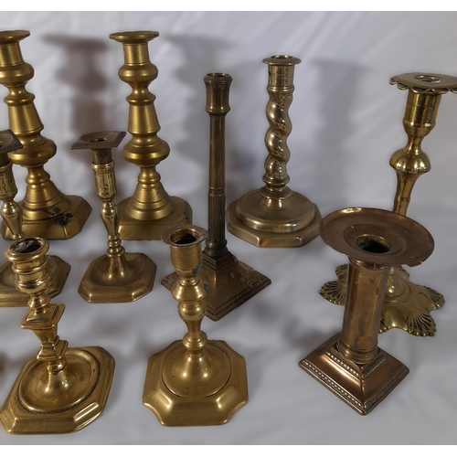 215 - EIGHT PAIRS OF 19TH CENTURY BRASS CANDLESTICKS, various styles and sizes, including knopped pillar a... 