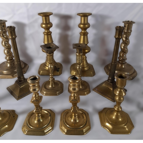 215 - EIGHT PAIRS OF 19TH CENTURY BRASS CANDLESTICKS, various styles and sizes, including knopped pillar a... 