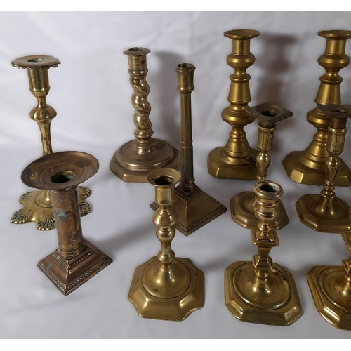 215 - EIGHT PAIRS OF 19TH CENTURY BRASS CANDLESTICKS, various styles and sizes, including knopped pillar a... 