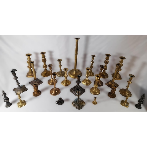 216 - SIX PAIRS OF 19TH CENTURY BRASS CANDLESTICKS, and a floral decorated gilt metal pair of candlesticks... 