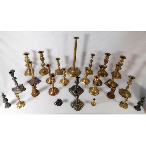 216 - SIX PAIRS OF 19TH CENTURY BRASS CANDLESTICKS, and a floral decorated gilt metal pair of candlesticks... 