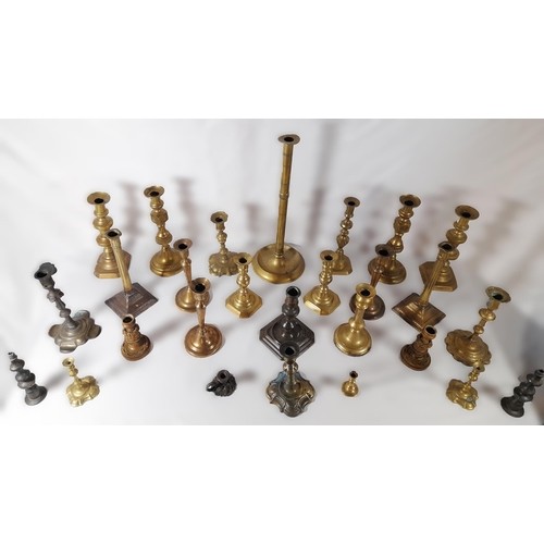 216 - SIX PAIRS OF 19TH CENTURY BRASS CANDLESTICKS, and a floral decorated gilt metal pair of candlesticks... 