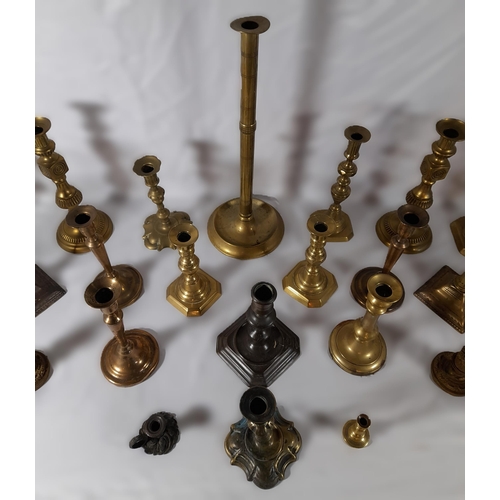 216 - SIX PAIRS OF 19TH CENTURY BRASS CANDLESTICKS, and a floral decorated gilt metal pair of candlesticks... 