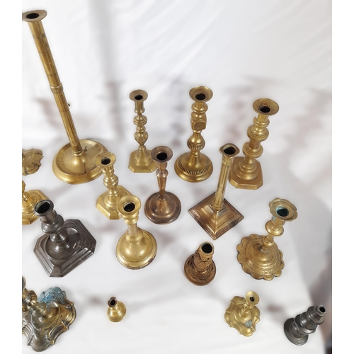 216 - SIX PAIRS OF 19TH CENTURY BRASS CANDLESTICKS, and a floral decorated gilt metal pair of candlesticks... 