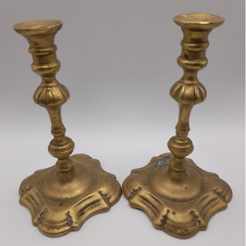 216 - SIX PAIRS OF 19TH CENTURY BRASS CANDLESTICKS, and a floral decorated gilt metal pair of candlesticks... 