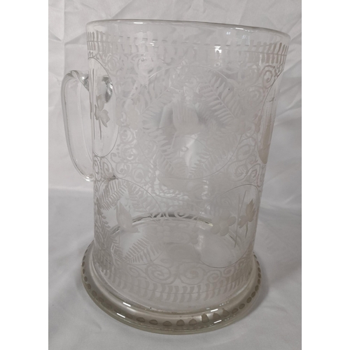 222 - AN EXCEPTIONAL 19TH CENTURY OVERSIZED GLASS TANKARD, the sides acid etched with circular reserve pan... 