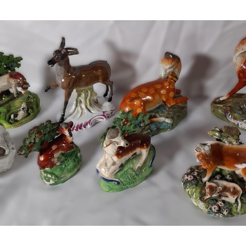 223 - A MIXED GROUP OF EARLY 19TH CENTURY ANIMAL MOUNTED BOCAGE MODELS, mostly Staffordshire, depicting de... 