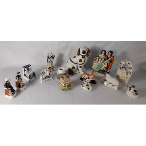 232 - A MIXED GROUP OF 19TH CENTURY POTTERY AND PORCELAIN MODELS, including a Staffordshire spaniel, four ... 